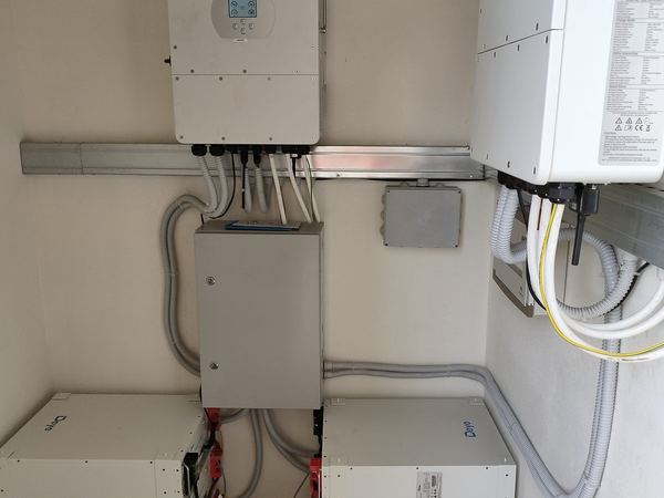 Inverters on rails with stacked batteries