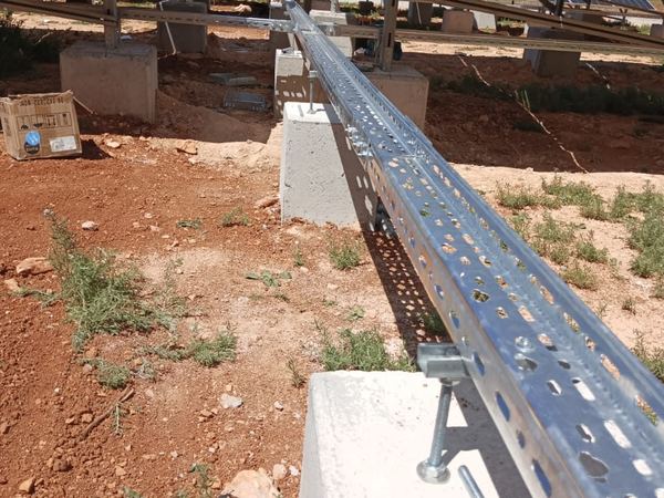 Cable tray on a concrete support between the rows
