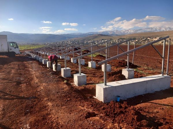 Steel structures being fixed on concrete footings