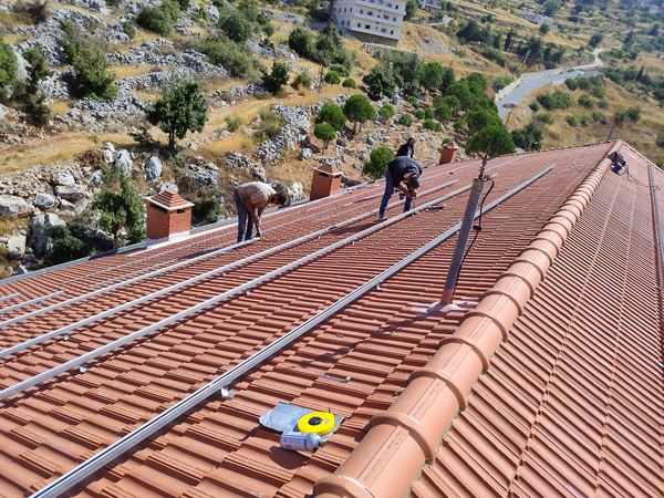 Rails being installed along the roof