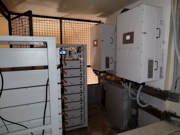 Inverters and battery racks in a caged room