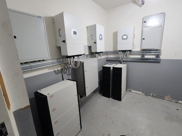 Inverters and batteries in a tiled room